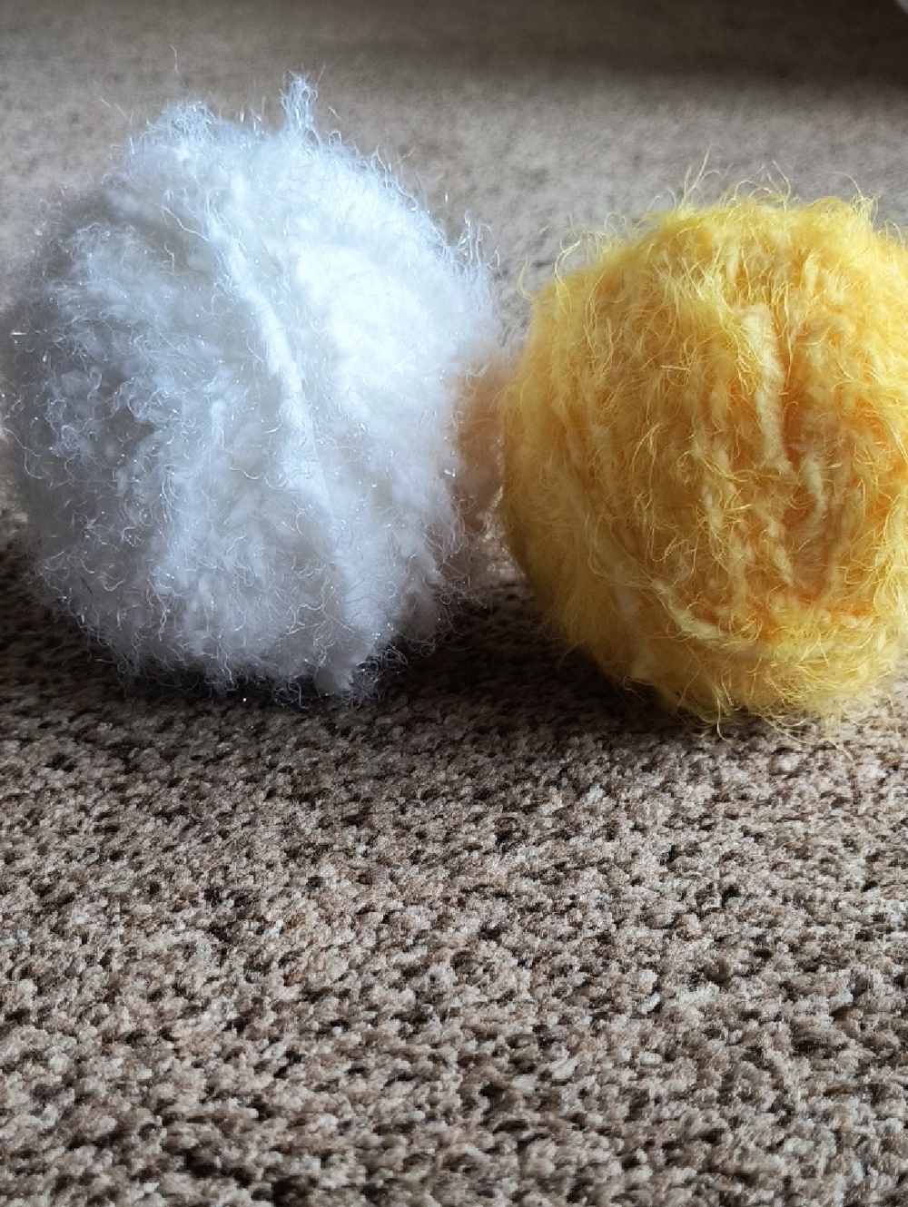 Two Soft White and yellow balls of Yarn